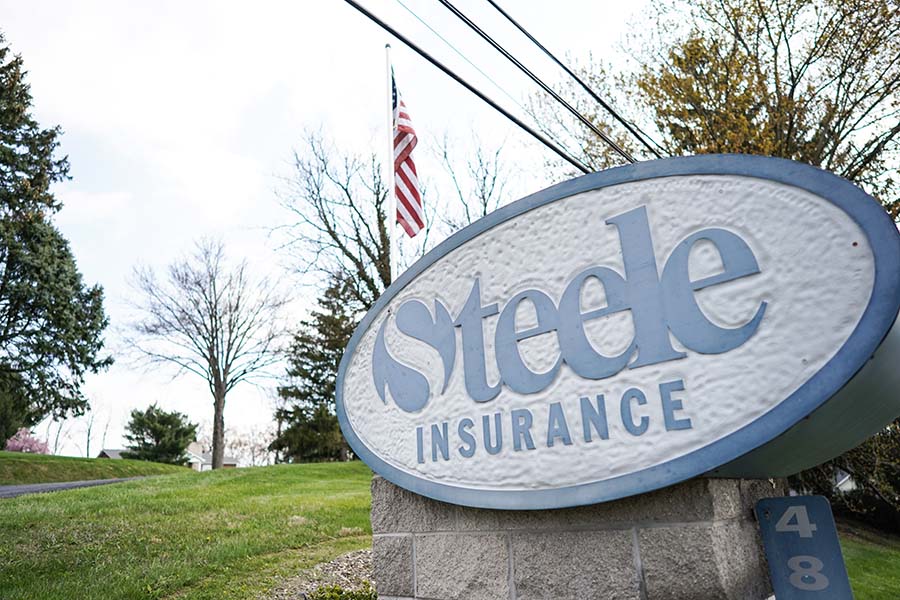 About Our Agency - View of Steele Insurance Logo Outside Office Building